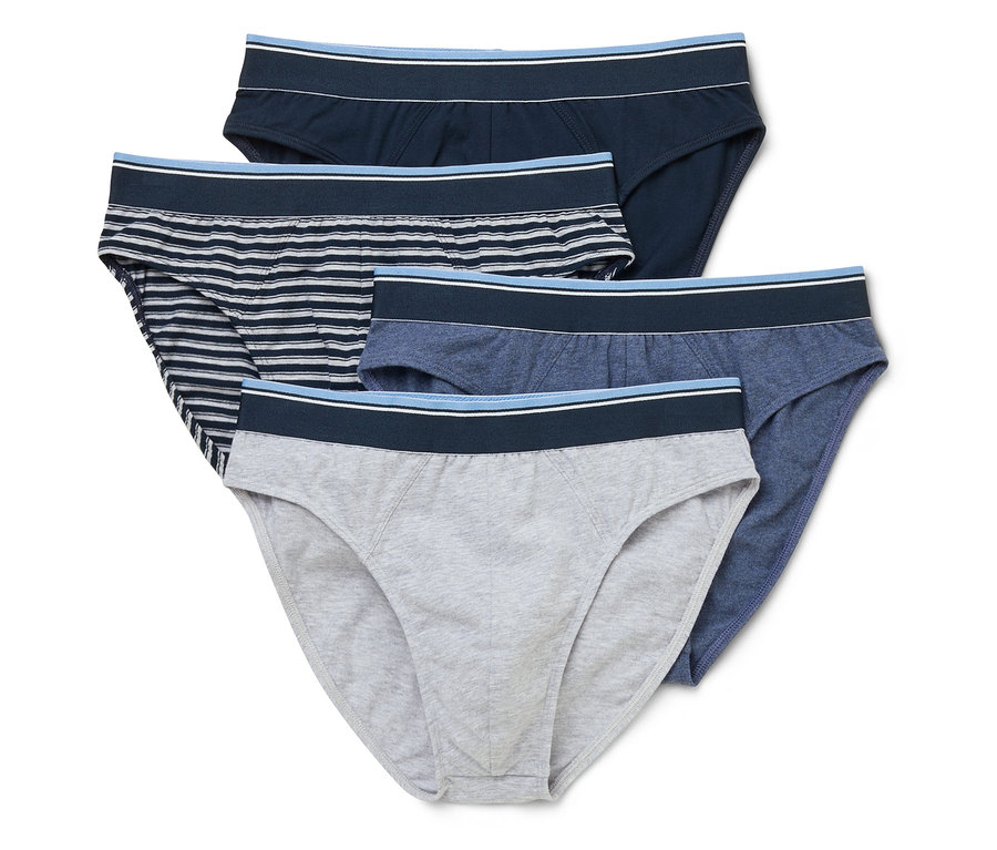 Cinq slips pour hommes en bleu marine, rayé, bleu clair et gris sont posés les uns sur les autres.