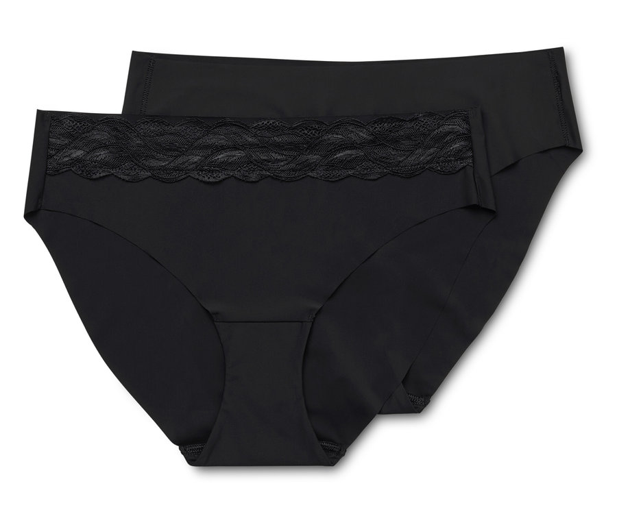 Deux culottes noires pour femmes sont posées l'une sur l'autre.