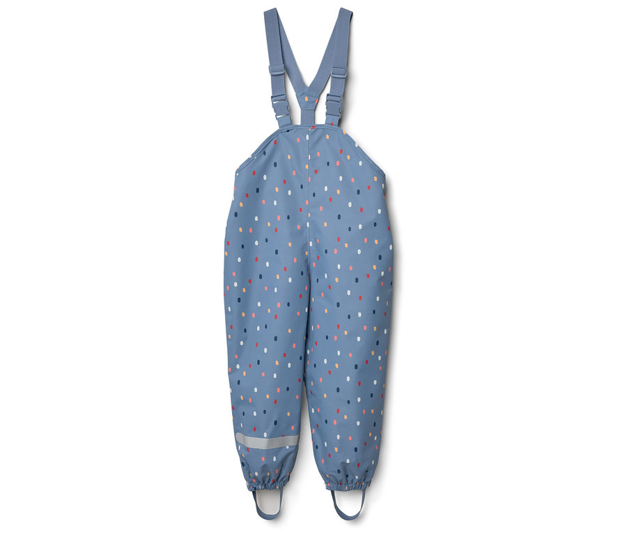 Pantalon de pluie pour enfant bleu à pois avec bretelles réglables et bandes réfléchissantes au bas des jambes.