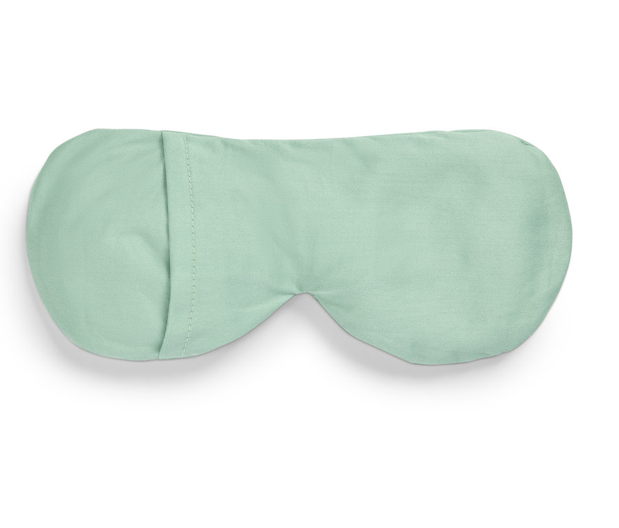 Masque de sommeil vert clair sur fond blanc.