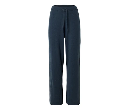 Pantalon en maille bleu foncé, coupe large, avec cordon de serrage à la taille.