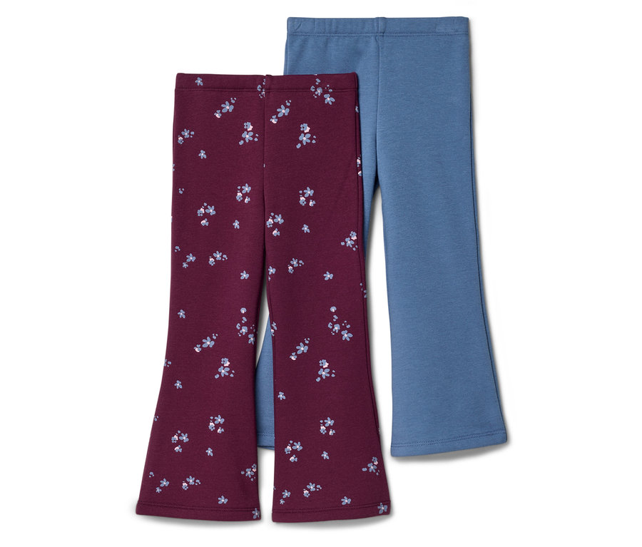 Deux paires de leggings évasés pour enfants. L'une est bordeaux avec un motif floral bleu clair, et l'autre est unie bleu clair. Elles sont présentées sur un fond blanc.