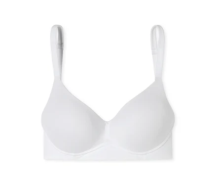 Soutien-gorge blanc sans coutures à armatures, avec bonnets moulés et bretelles réglables, sur fond blanc.