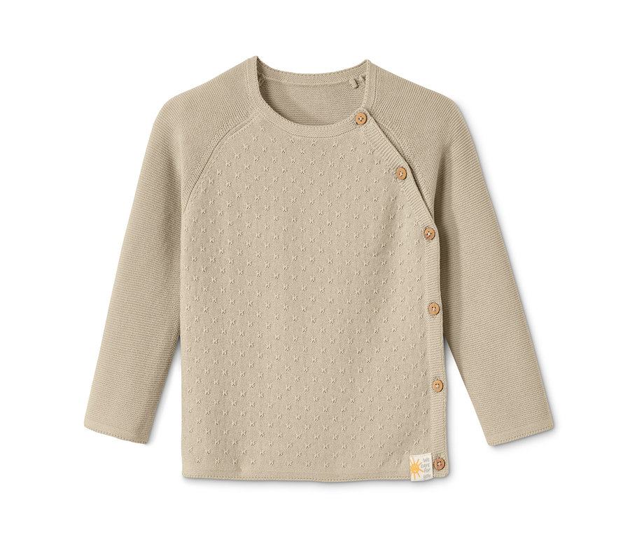 Jaquette en maille bébé beige à manches longues et boutons.