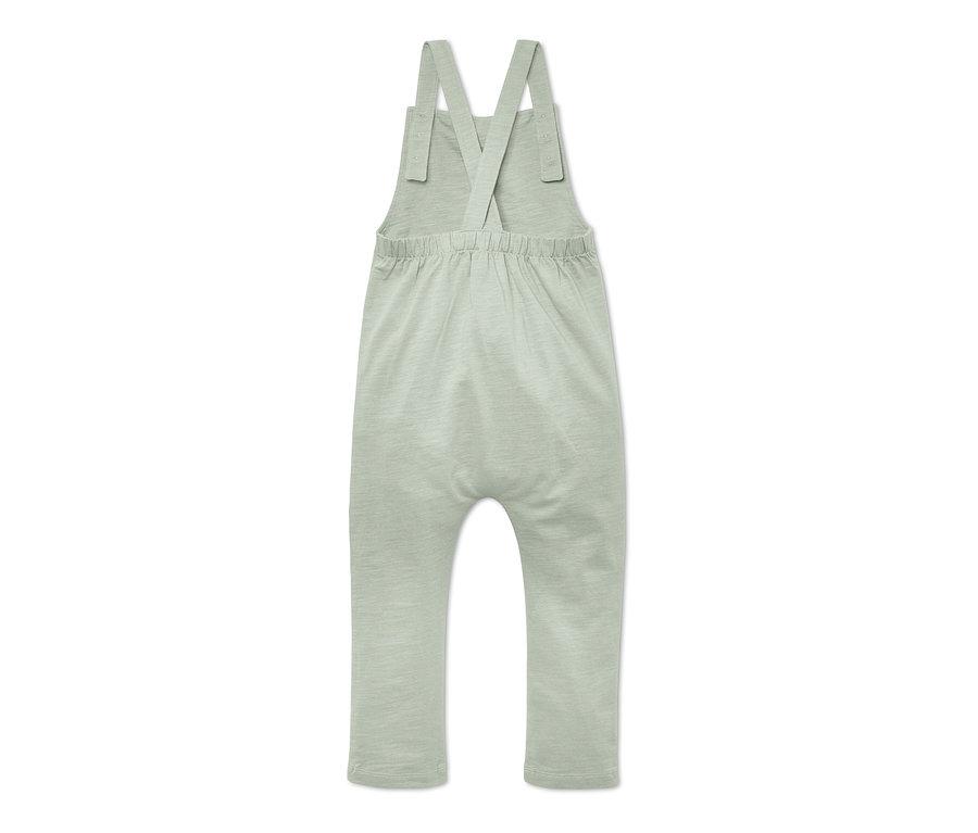 Vue arrière d'une salopette pour bébé vert clair.
