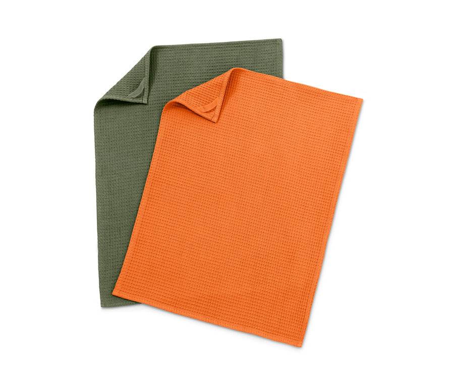 Deux torchons de cuisine à nids d’abeilles, un vert, un orange.