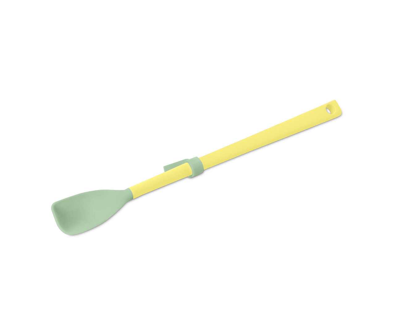 Une cuillère spéciale en silicone jaune et verte sur un fond blanc.