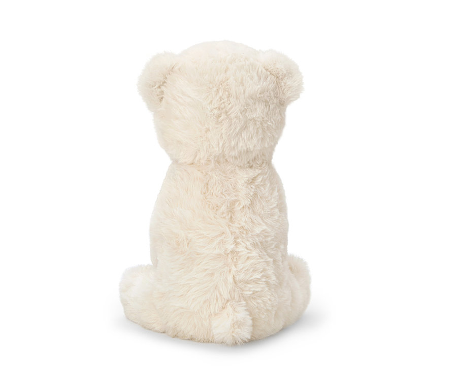 Vue arrière d'une peluche Ours polaire assise sur un fond blanc.