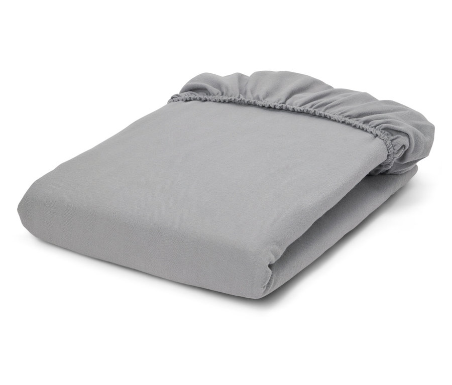 Drap-housse gris plié avec coins élastiques.
