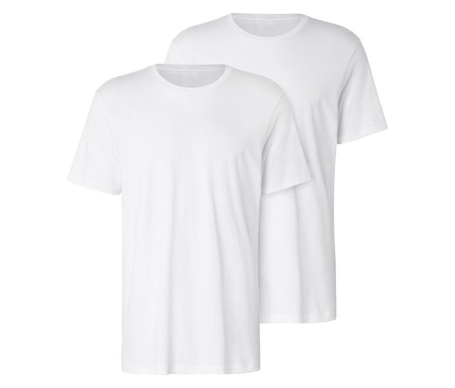 Deux t-shirts blancs sont placés l'un sur l'autre.