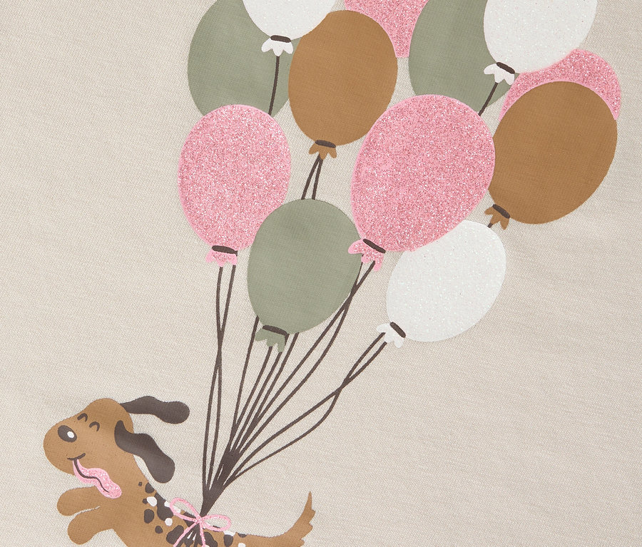 Graphique d'un chien de dessin animé accroché à une série de ballons.