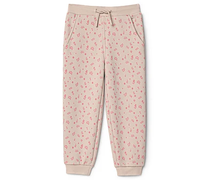 Pantalon de jogging enfant beige avec motif floral rose, taille élastique, cordon de serrage et chevilles resserrées.