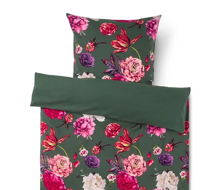 Parure de lit vert foncé avec motif floral vif rose, rouge et violet et feuilles vertes, plus une section unie vert foncé repliée.