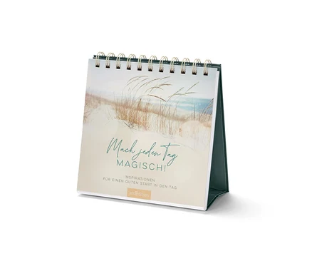 Gros plan d'un livre-présentoir de table « Mach jeden Tag magisch » (en allemand).