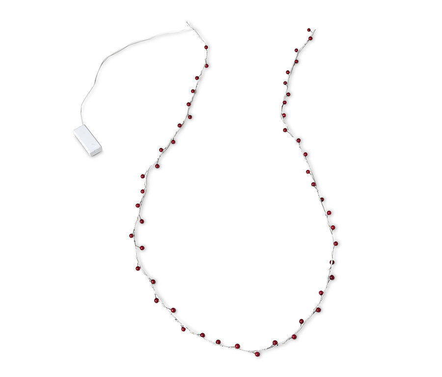 Une branche décorative à LED avec des baies rouges sur un fond blanc.
