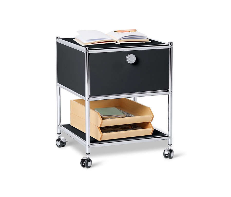 Table d'appoint en métal noire « CN3 » avec tiroir et un livre ouvert sur le dessus.