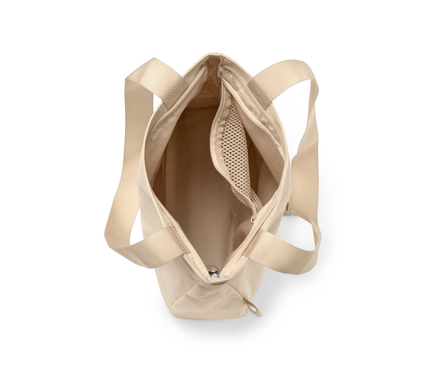 Vue de dessus d'un sac à bandoulière de sécurité beige ouvert.