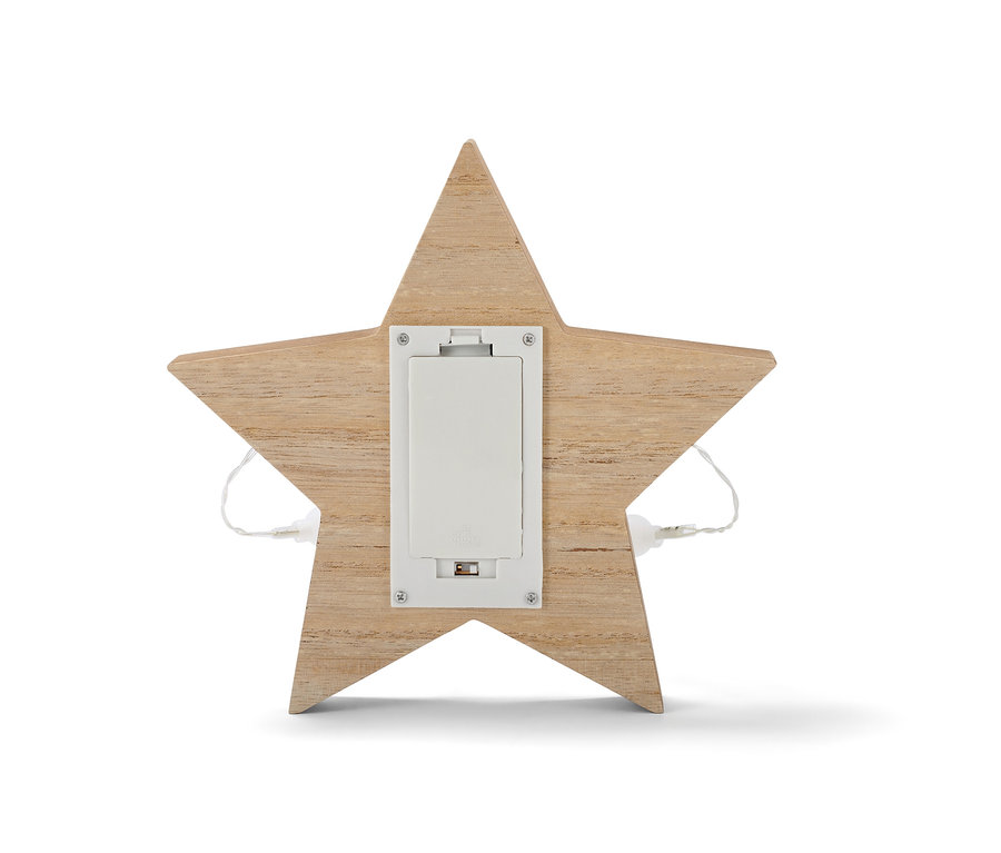 Gros plan sur l'arrière d'une figurine décorative à LED en bois Étoile avec compartiment à piles visible.
