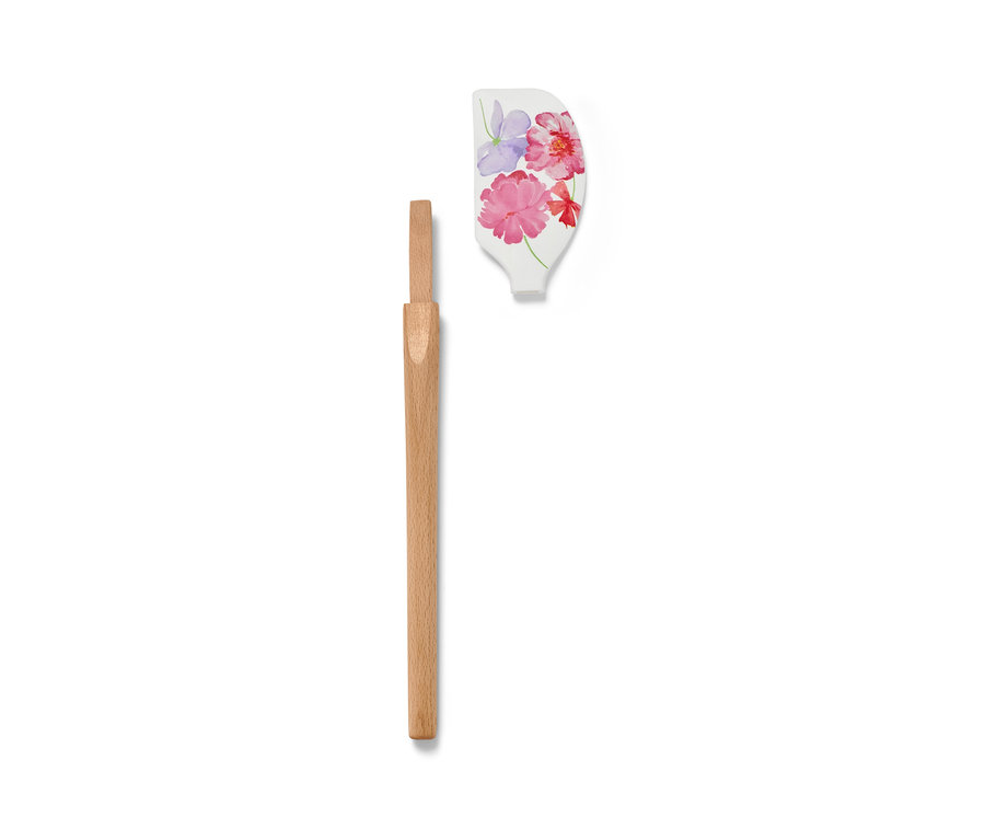 Spatule démontée avec motif floral et manche en bois.