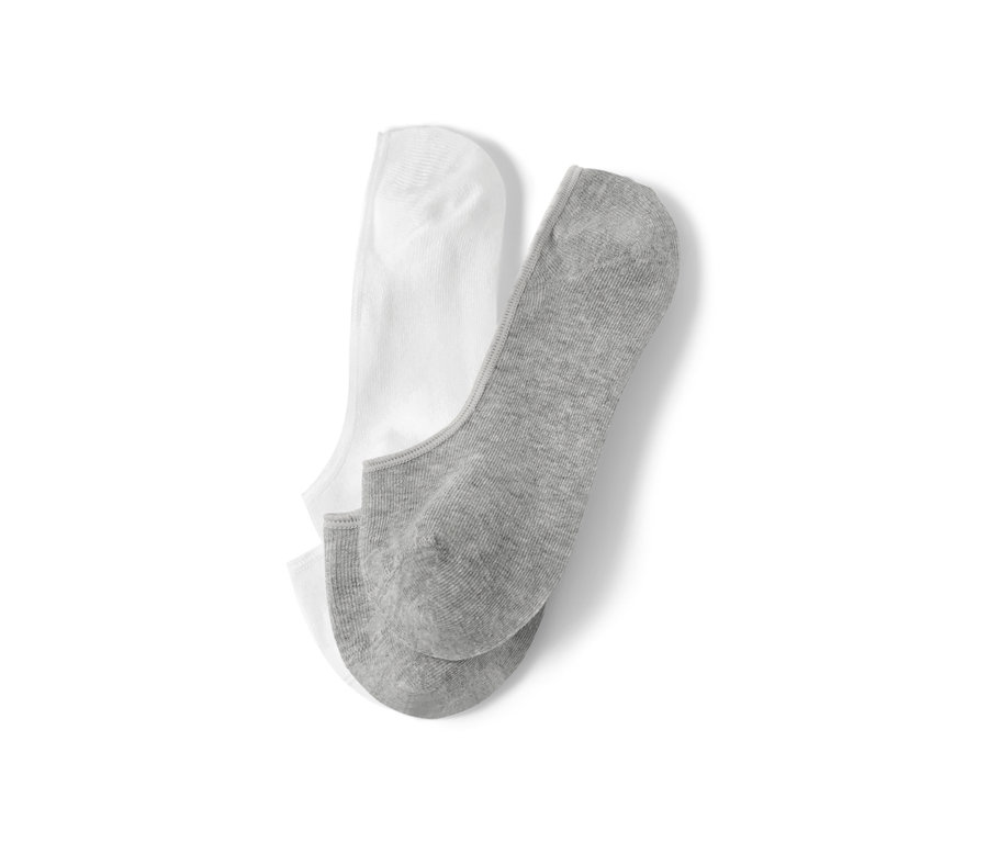 Deux paires de socquettes de sport invisibles, une paire blanche, une paire grise.