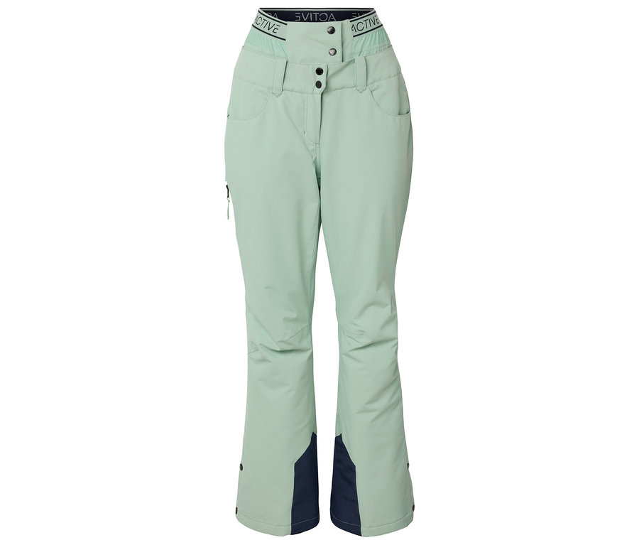 Pantalon de ski vert clair avec des empiècements bleu marine en bas des jambes.