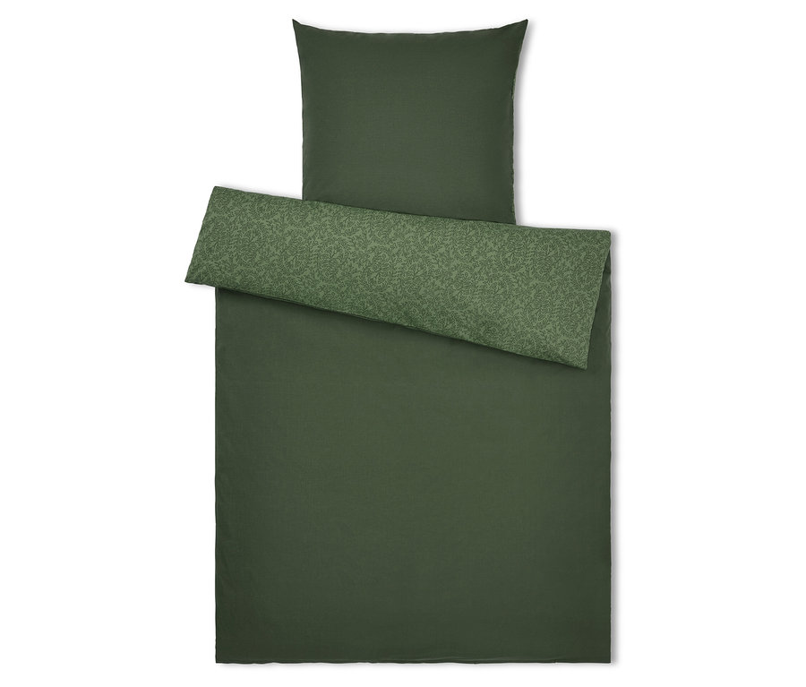 Linge de lit vert avec oreiller et jeté de lit à motif de feuilles.