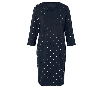 Robe bleue à pois blancs avec manches 3/4.