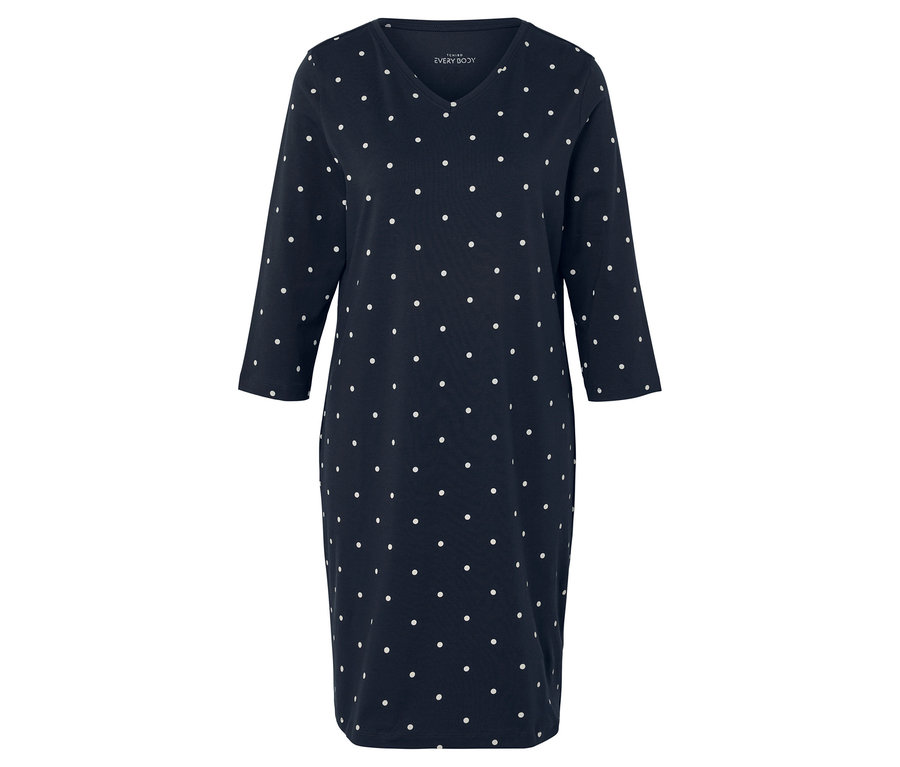 Robe bleue à pois blancs avec manches 3/4.