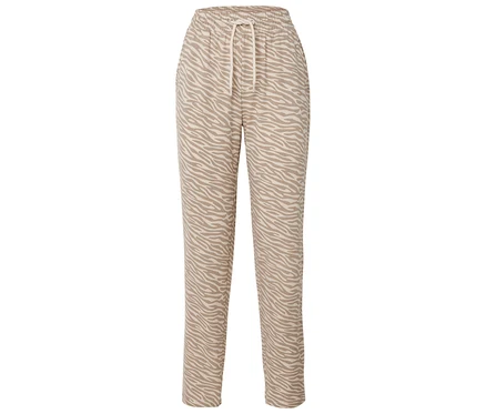 Une paire de pantalons beiges avec un imprimé animalier et un cordon de serrage.