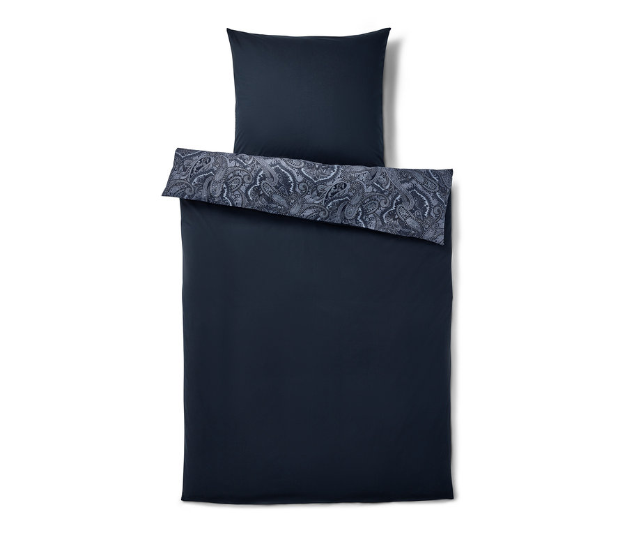 Parure de lit en renforcé bleu taille normale avec un motif floral sur la taie d'oreiller.