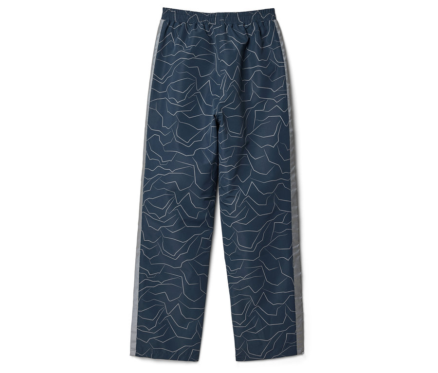 Un pantalon bleu marine avec un motif abstrait et une bande latérale grise à plat.