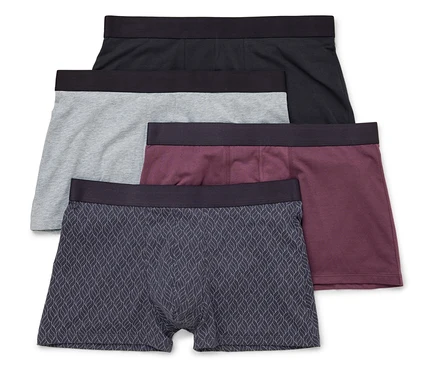 Quatre boxers pour hommes en noir, gris, bordeaux et à motif de feuilles sont superposés.