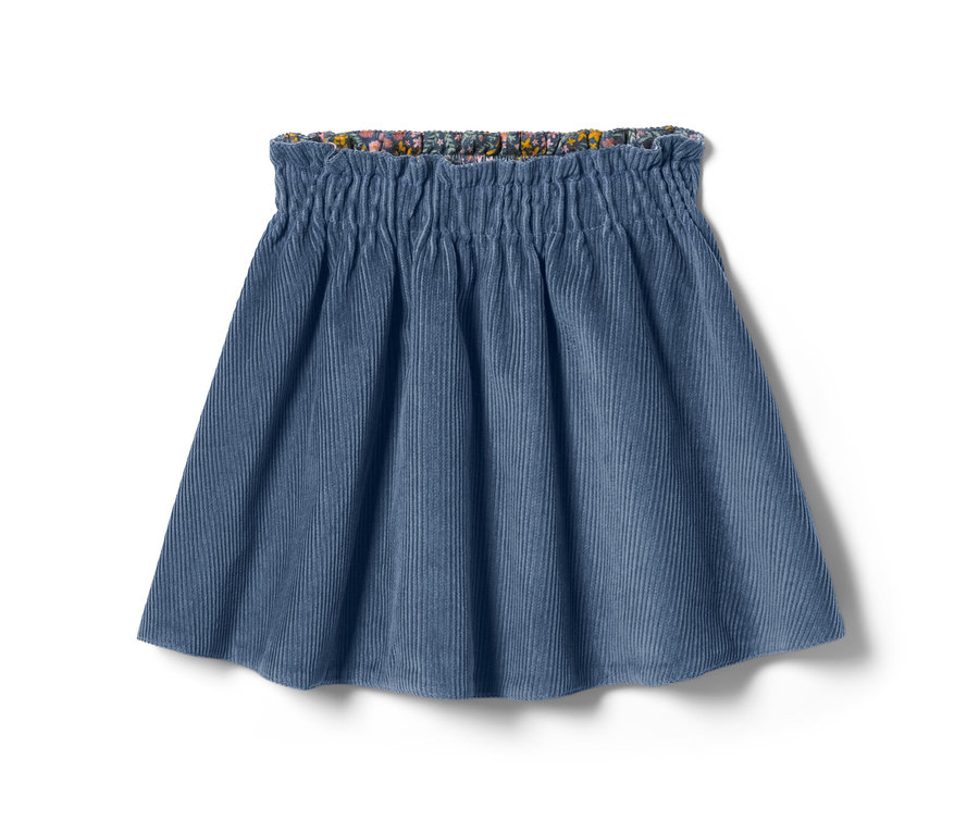 Jupe réversible en velours côtelé bleue avec une taille fleurie.