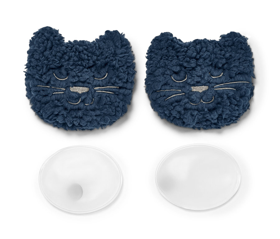Deux chaufferettes de poche, « chat » et deux capsules rondes transparentes sur fond blanc.