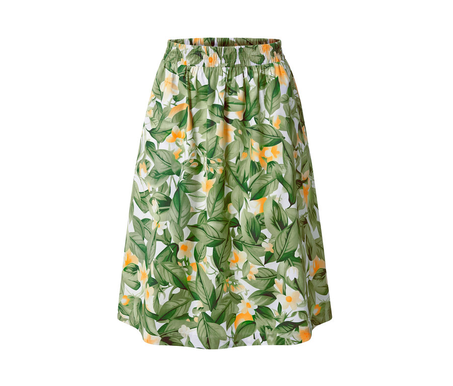 Jupe imprimée en popeline avec des feuilles vertes et des fleurs jaunes sur fond blanc.