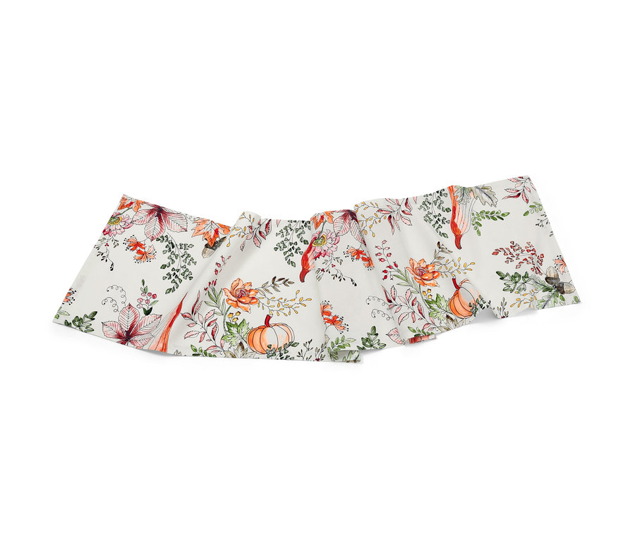 Chemin de table avec un motif automnal de citrouilles et de feuilles.