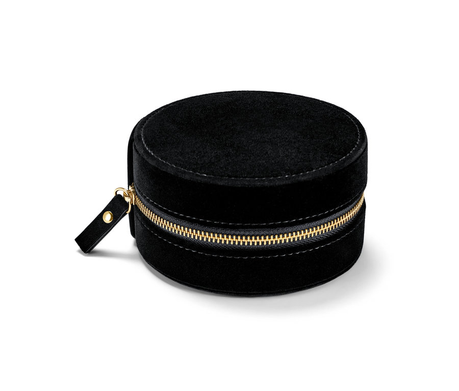 Petite boîte à bijoux ronde noire avec une fermeture éclair dorée.