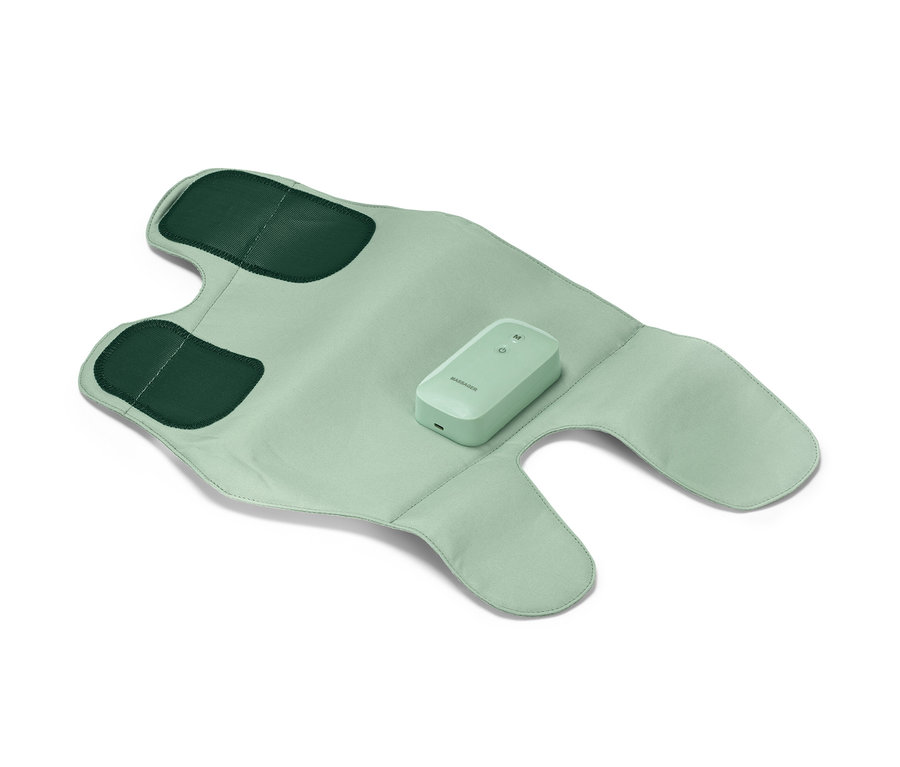 Une manchette de massage sans fil vert clair est étalée, avec des applications vert foncé et une commande au milieu.