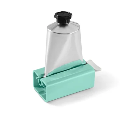 Un tube argenté dans un presse-tube turquoise.