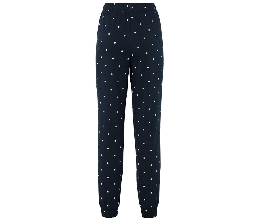 Pantalon de jogging bleu marine à pois blancs.