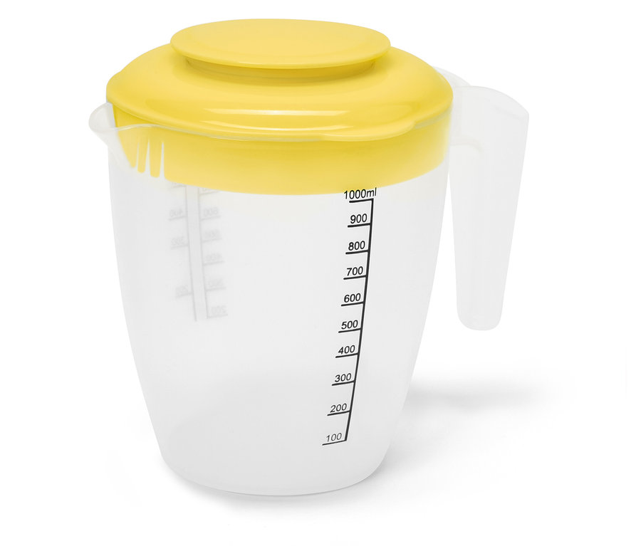 Un verre mesureur transparent avec un couvercle jaune et une échelle de volume.