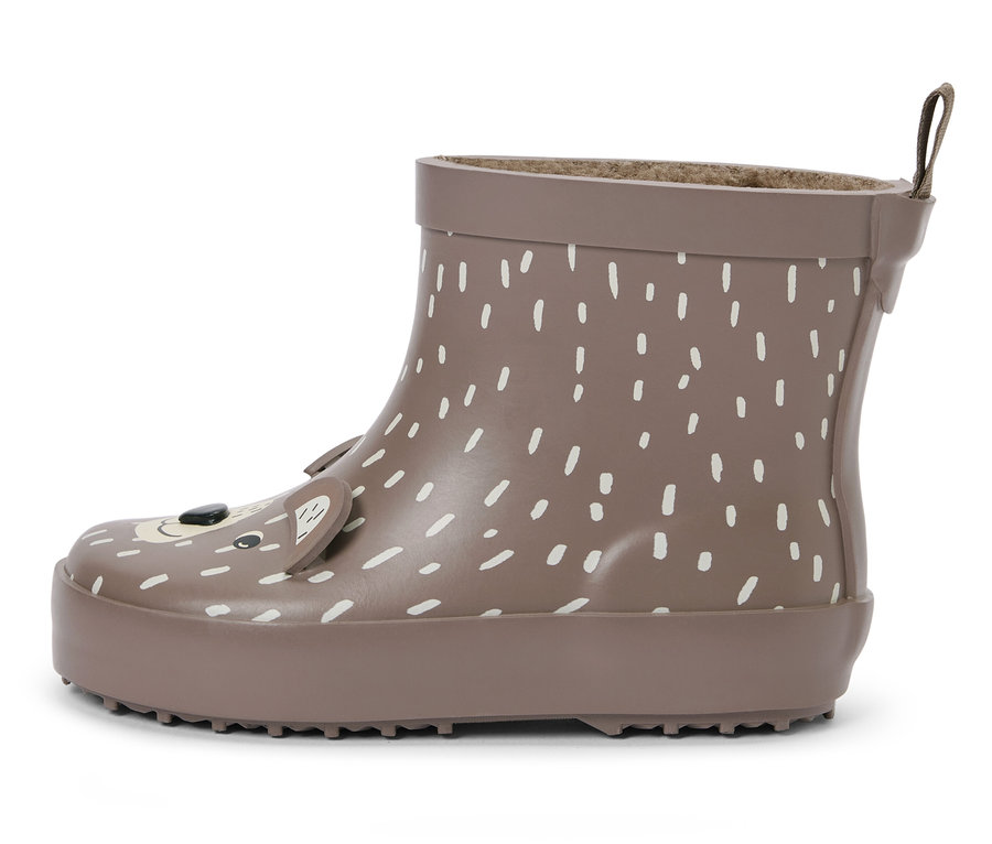 Une botte de pluie marron pour enfants avec des points blancs et un visage d'ours.