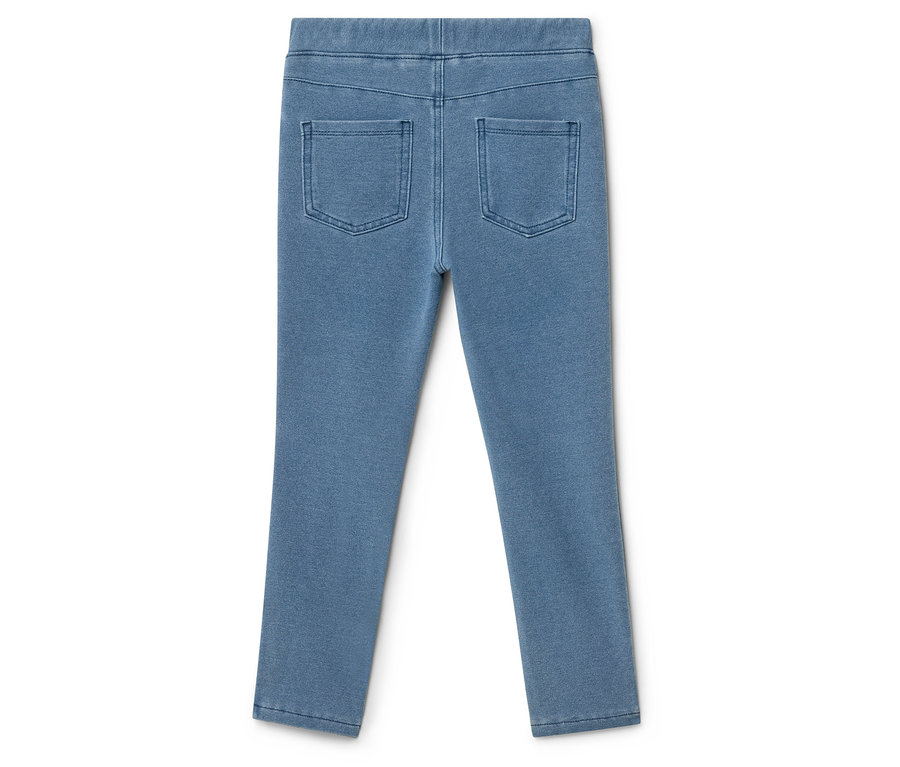 Des leggings bleu clair avec deux poches arrière posés sur un fond blanc.