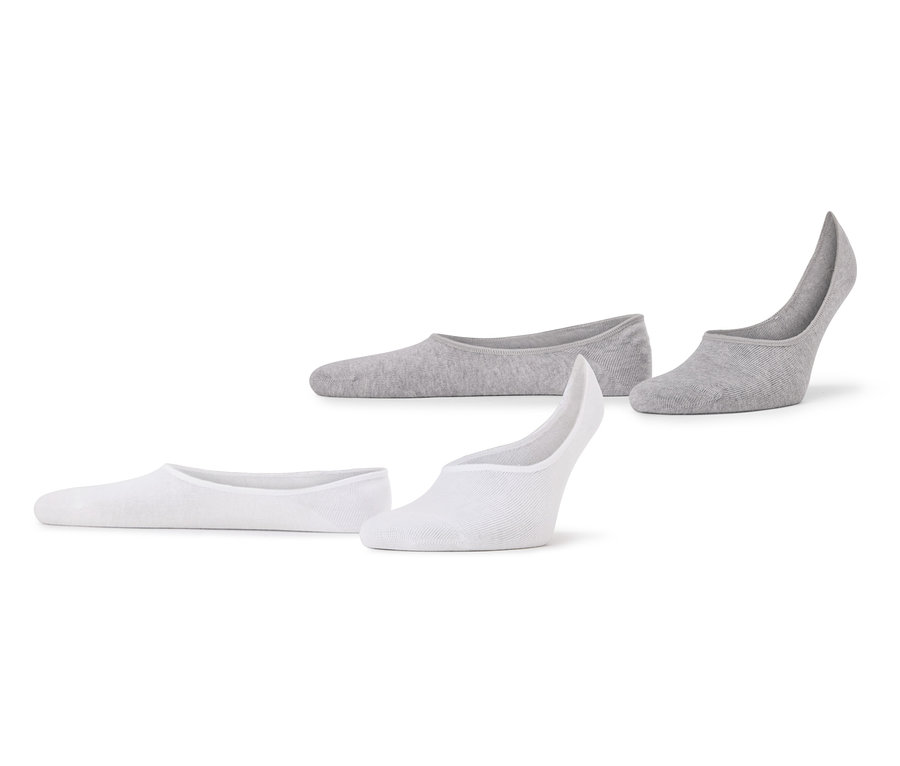 Deux paires de socquettes, une grise et une blanche, sont posées sur un fond blanc.
