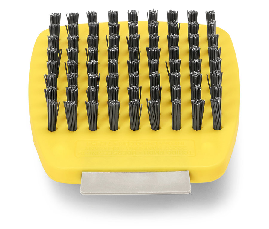 Brosse jaune avec de nombreuses petites soies noires.
