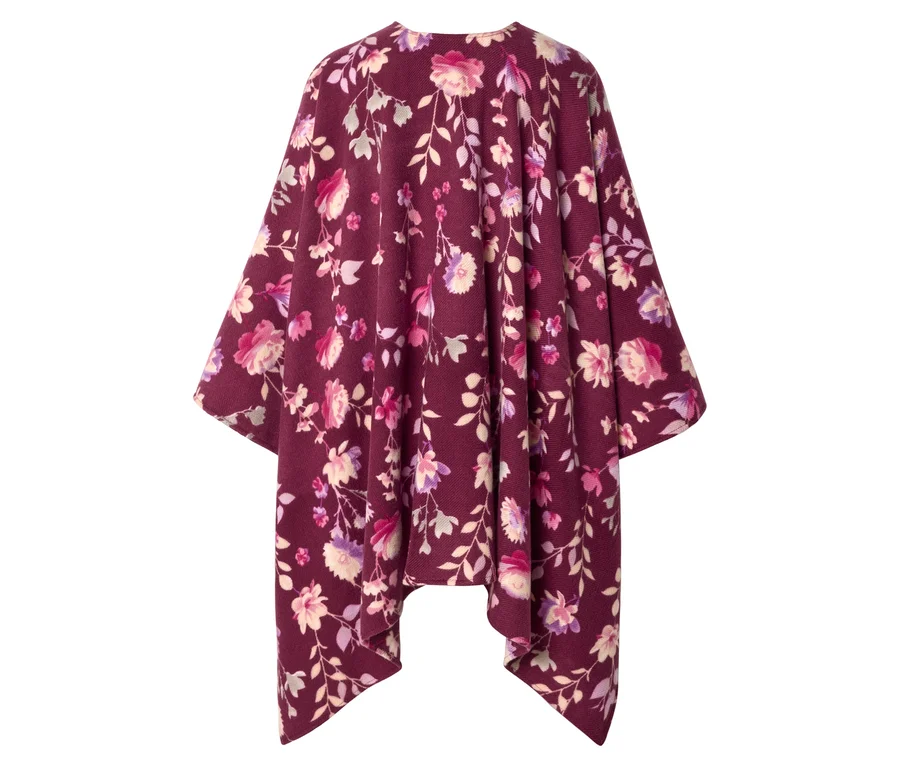 Un poncho bordeaux à motif floral rose, violet et crème.