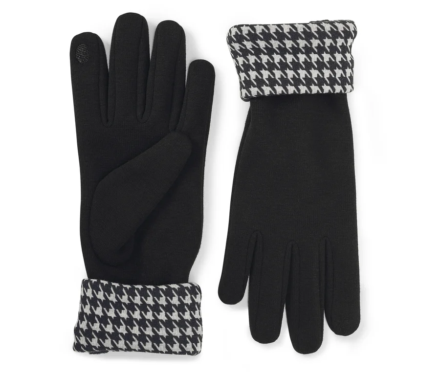 Une paire de gants noirs avec des poignets repliés à motif pied-de-poule noir et blanc. Un gant est présenté paume vers le haut, l'autre paume vers le bas.