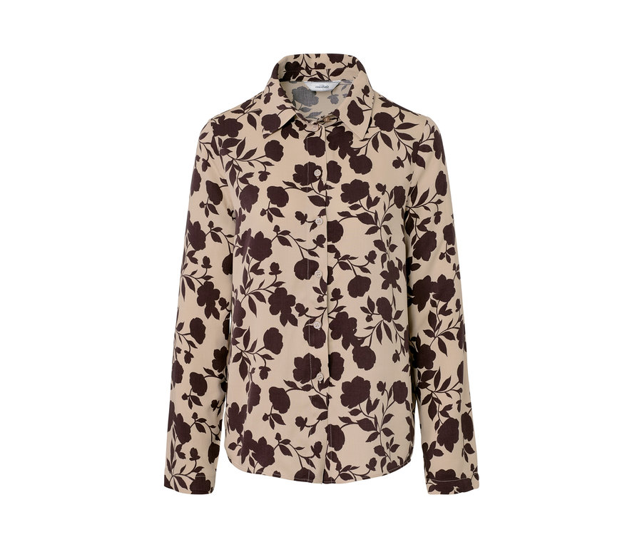 Un chemisier à imprimé intégral avec des fleurs marron sur un fond beige.