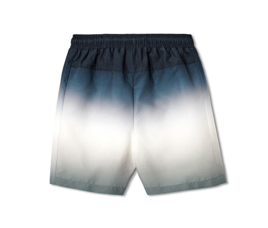 Détail d'un boardshort pour enfant avec un dégradé de couleurs bleu et blanc.