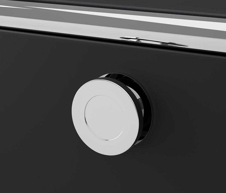 Détail d'un meuble en métal noir CN3 avec une poignée ronde argentée.